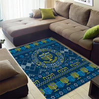 Blue Hanukkah area rug with menorah emblem and starry geometric design, “Happy Hanukkah”
