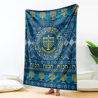 Blue Hanukkah blanket with menorah, Star of David pattern, and 'Happy Hanukkah' text