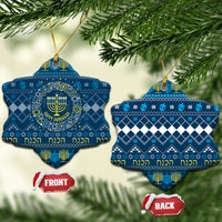 Blue ceramic Hanukkah ornament set, star shape with menorah pattern and gold hanging loop.