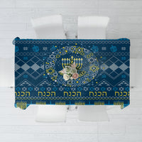Blue Hanukkah tablecloth with menorah, stars, and geometric patterns
