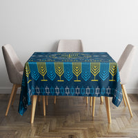 Blue Hanukkah tablecloth on round dining table with geometric and menorah design