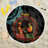 Round black Kwanzaa mandala beach blanket with white fringe, Happy Kwanzaa text