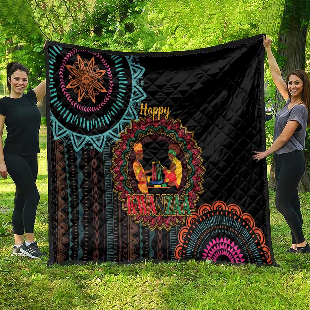 Black Kwanzaa quilt with large turquoise mandala border and “Happy Kwanzaa” center