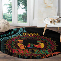 Black round Kwanzaa mandala carpet featuring “Happy Kwanzaa” and seated candleholder art.