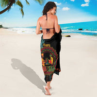 Black African sarong hanging to mid-calf with Kwanzaa figure medallion