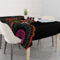 Black tablecloth with magenta sunburst mandala and teal orange geometric accents