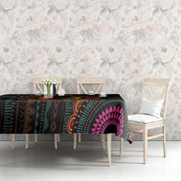 Black Kwanzaa tablecloth with teal, orange, and pink mandala motifs on dining table
