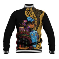 Black baseball jacket with striped ribbed collar and colorful Kwanzaa scene on back