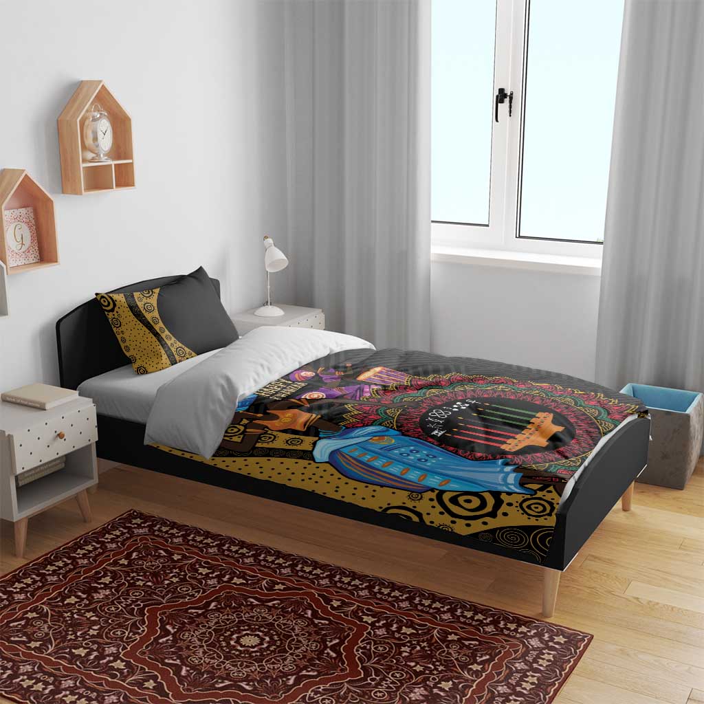 Black African Kwanzaa bedding set on bed with patterned pillows in a bedroom setting
