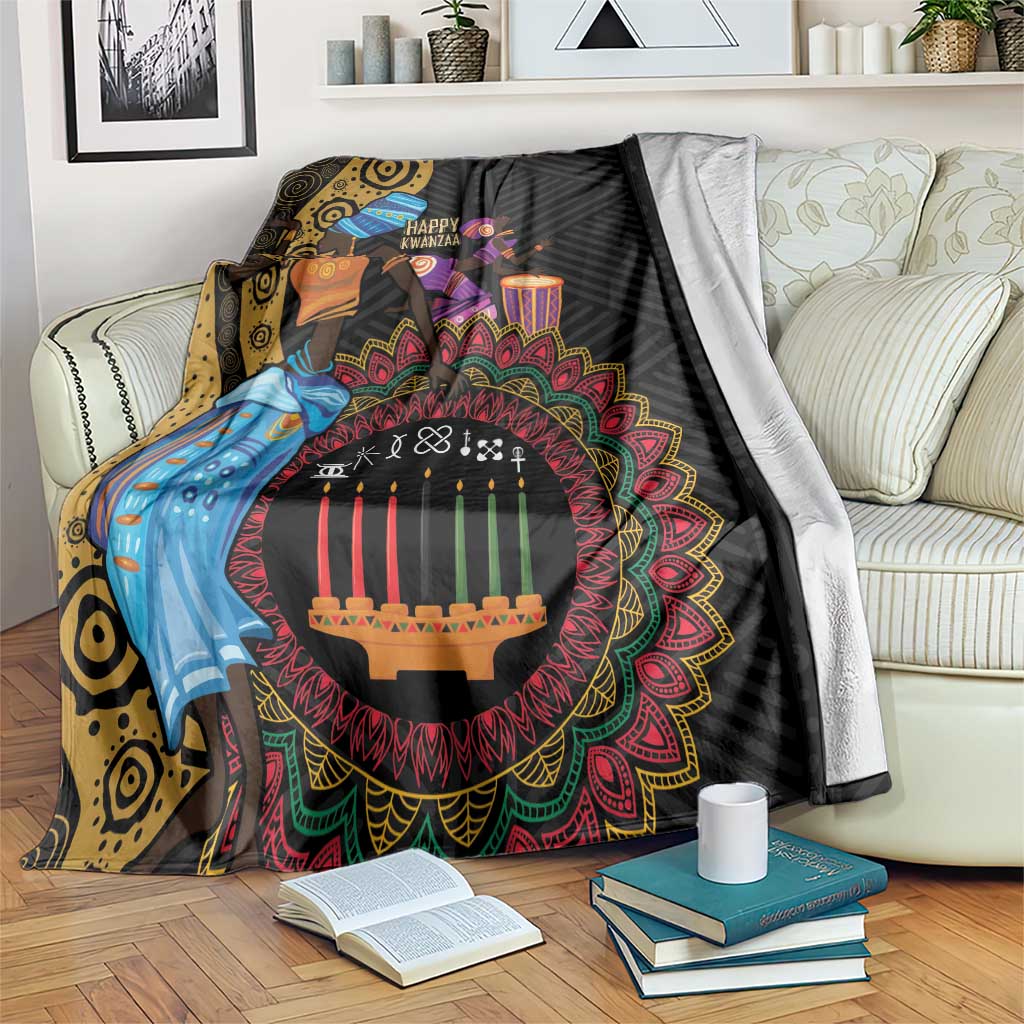 Black African tribal blanket with colorful Kwanzaa candles and figures, draped on sofa