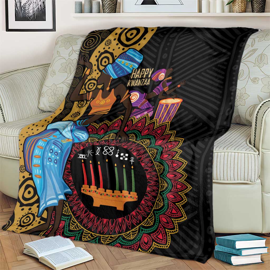Black Kwanzaa African blanket with patterned dancer and candle mandala, on living room couch