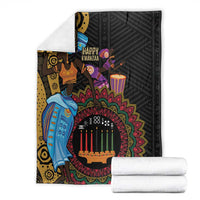 Black Kwanzaa African blanket with colorful candle circle and figures, folded with white stacks