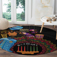 Black round tribal carpet with colorful circular border and candle centerpiece in living room
