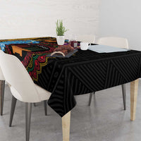 Black tablecloth with geometric striped pattern and colorful tribal border