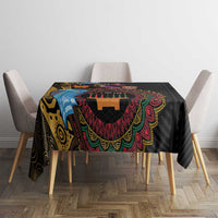 Black tablecloth with vibrant tribal medallion print and colorful fringe
