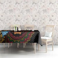 Black tribal tablecloth with colorful decorative band across the center
