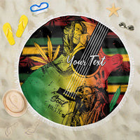 Round beach blanket with white fringe, reggae-style portrait guitar graphic and 'YourText'.