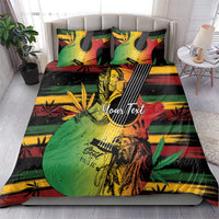 Bedding set on bed with two pillows; green red yellow reggae music graphic with YourText