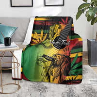 Reggae-style blanket laid over a couch with illustrated musician and 'Your Text' print