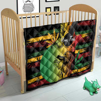 Reggae soul quilt in a wooden crib, with black quilting and colorful reggae guitar artwork