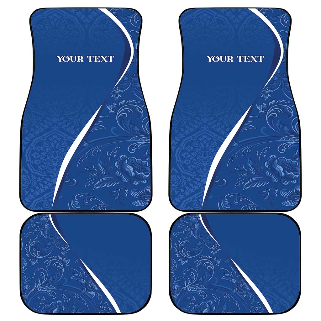 Set of four blue car floor mats with white swoosh and 'YOUR TEXT' text
