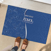 Blue rubber doormat with floral scroll pattern and ITALY personalized text, partial view