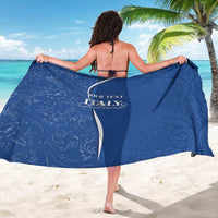 Blue personalized sarong with decorative scroll pattern and custom text, worn by model