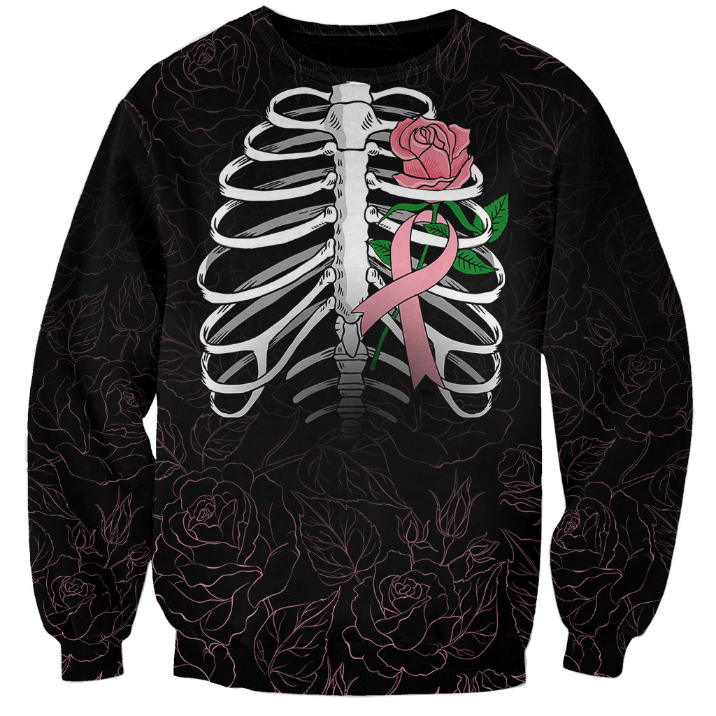 Black unisex sweatshirt with skull ribcage graphic, pink rose and awareness ribbon