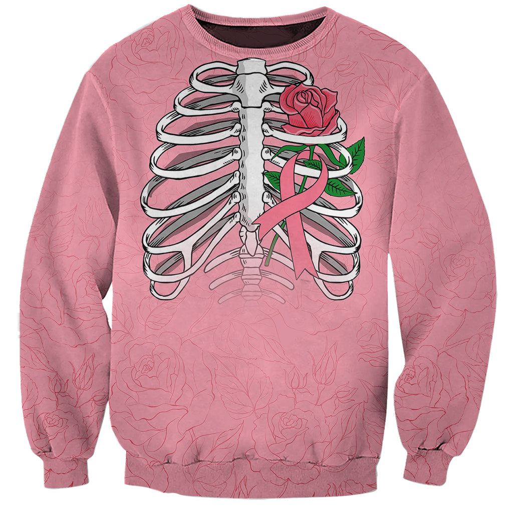 Pink unisex sweatshirt with crew neck and long sleeves, skull and rose ribbon graphic