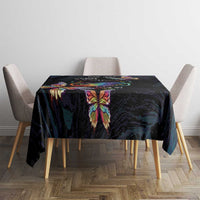 Dark navy tablecloth with central multicolor butterfly print on square dining table