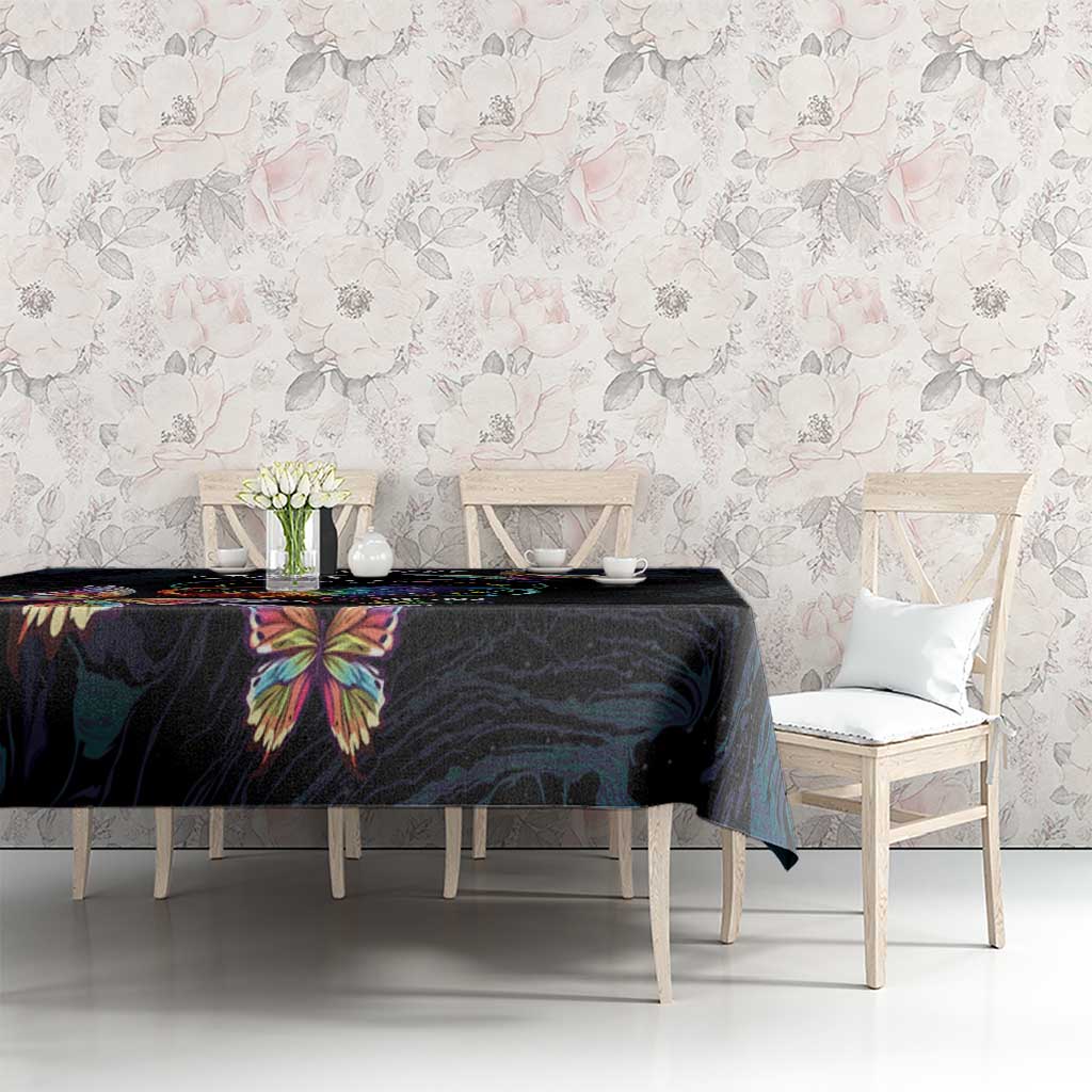 Dark navy tablecloth with multicolor butterfly print on dining table