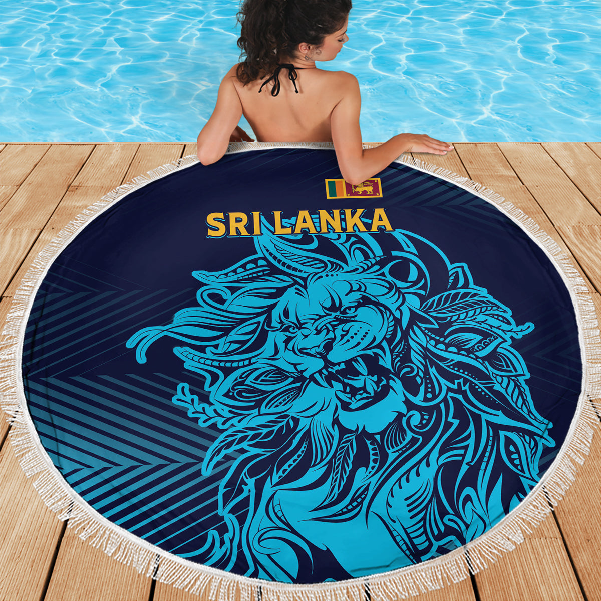 Round Sri Lanka beach blanket with blue lion artwork, navy background, white fringe trim