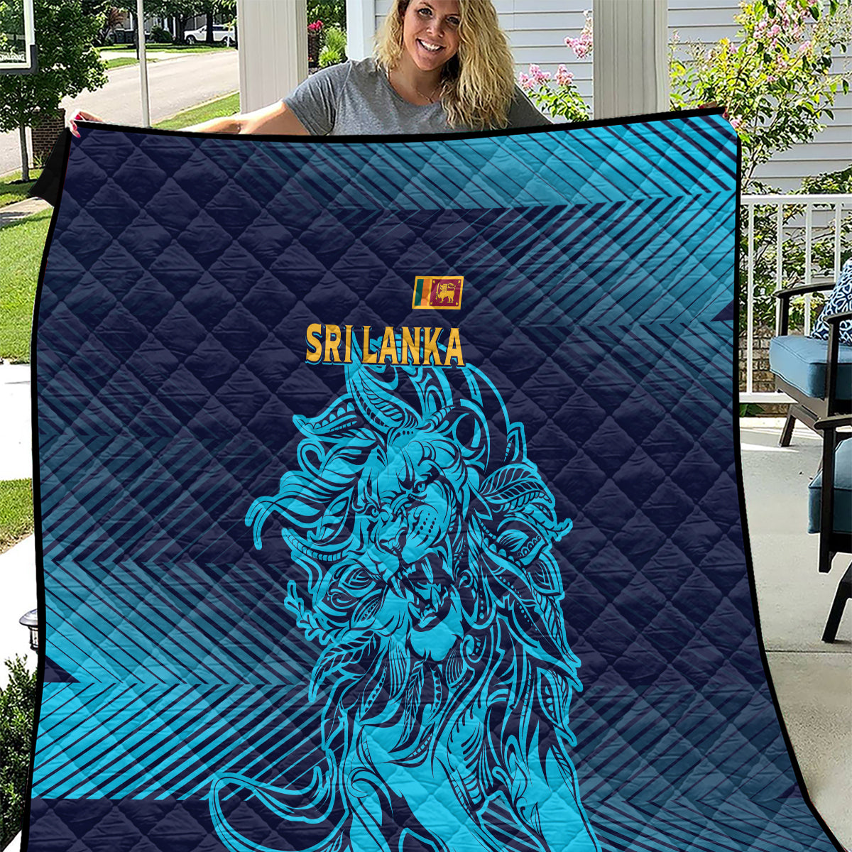 Quilted blanket with dark navy and blue gradient, Sri Lanka lion graphic in neon blue.
