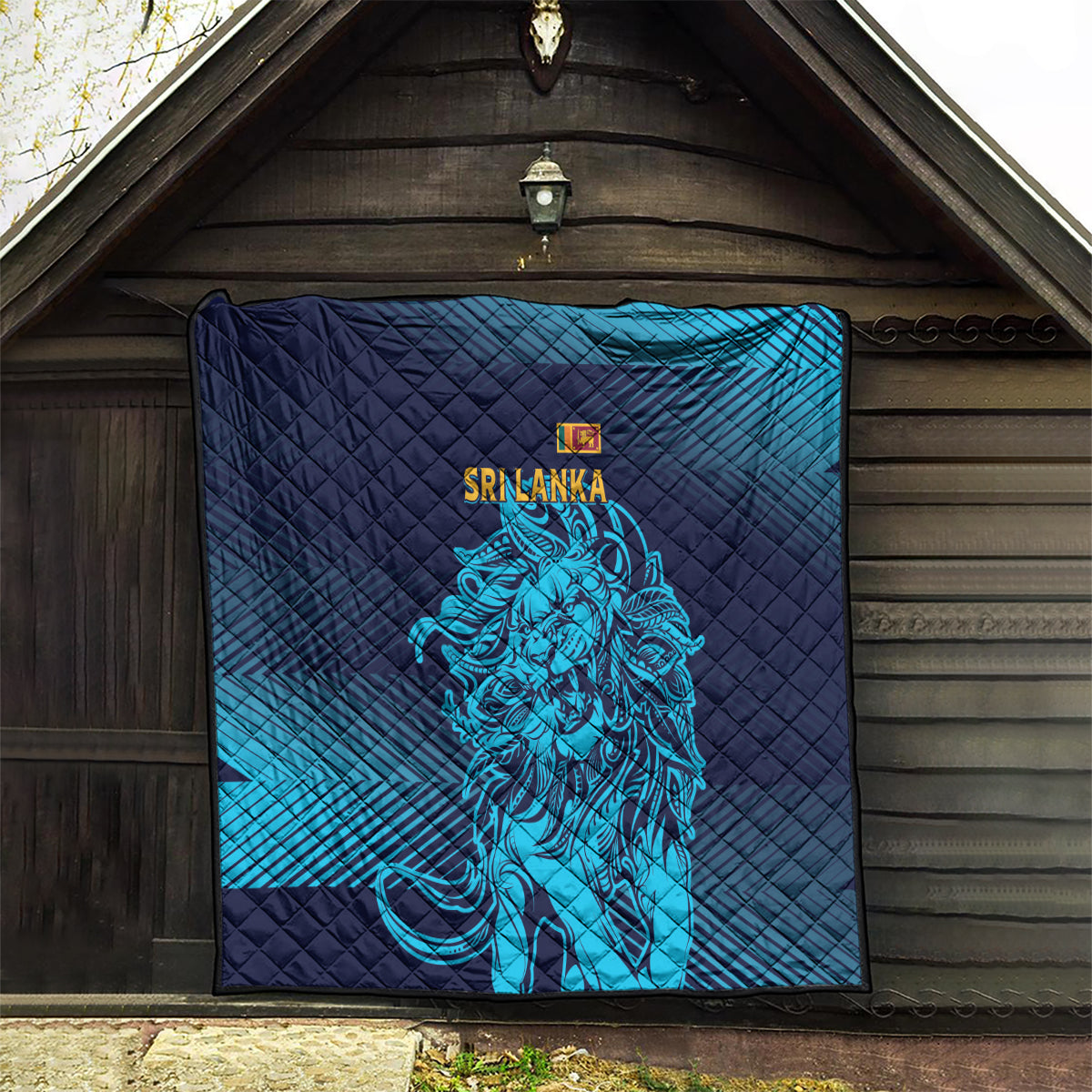 Quilted wall or hanging blanket in dark navy and teal-blue stripes with lion emblem.