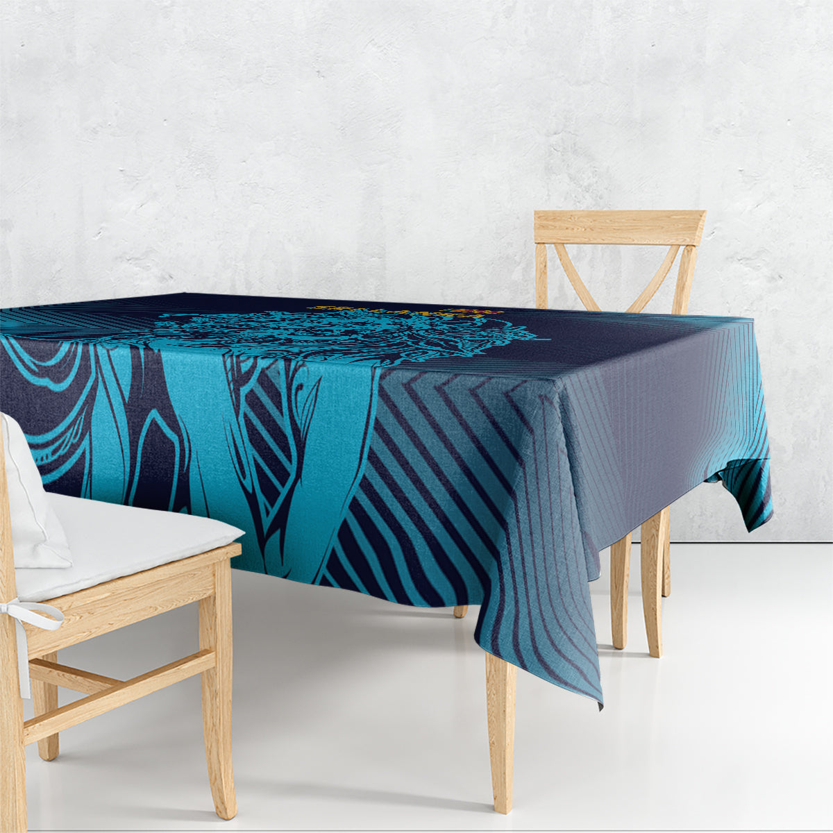 Blue and navy geometric tablecloth draped over a dining table, cyan stripe design