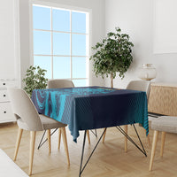 Blue and navy cricket tablecloth with bold geometric lion-style artwork on dining set