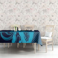 Navy and cyan patterned tablecloth on a dining table with two chairs