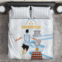 White comforter and pillowcases with light blue stripes and Argentina central print