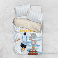 White and light blue striped comforter with Argentina-themed emblem graphic