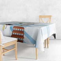 White tablecloth with light blue stripe pattern and colorful Argentina-style graphic