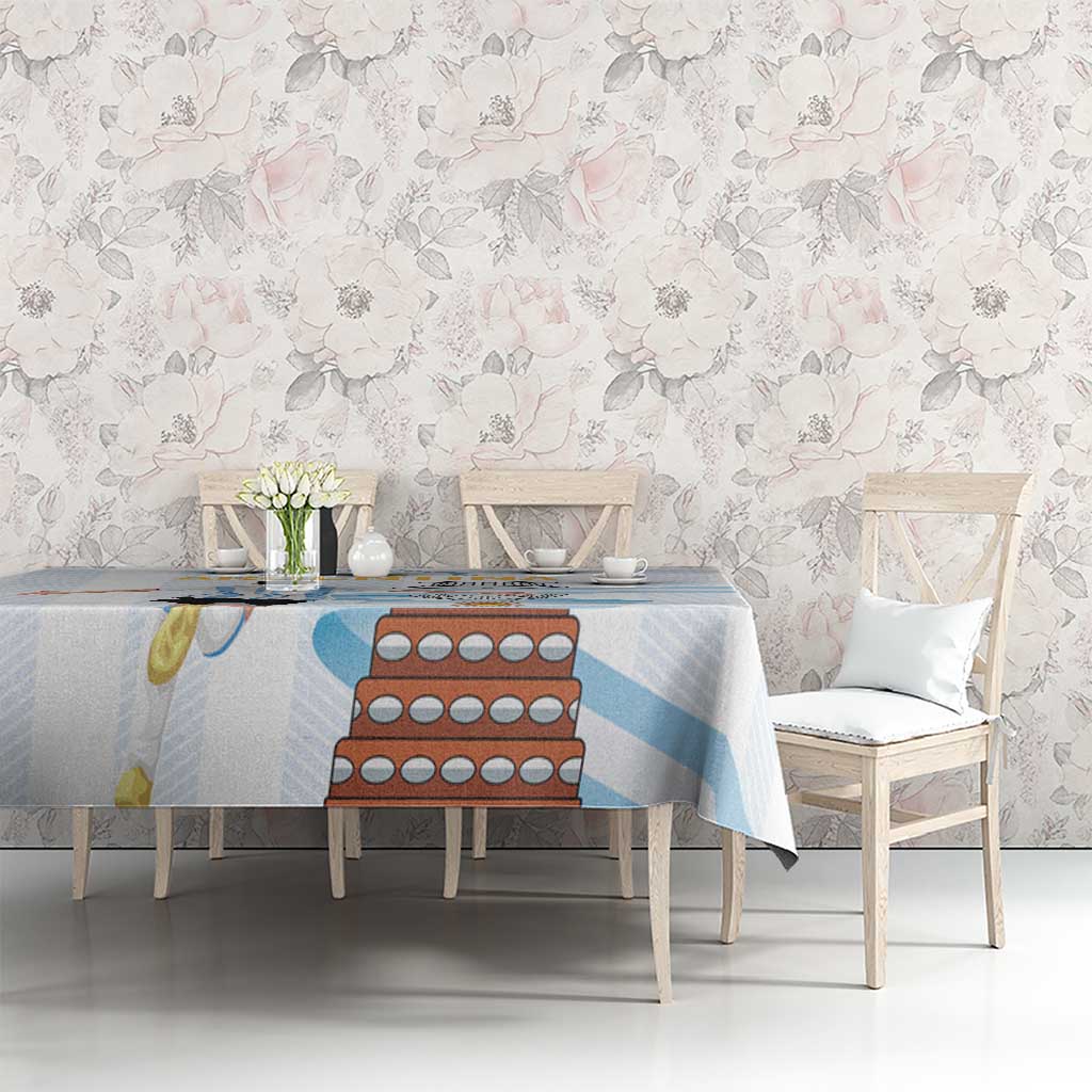 White tablecloth with light blue stripes and Argentina-themed graphic on tabletop