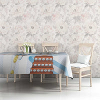 White tablecloth with light blue stripes and Argentina-themed graphic on tabletop