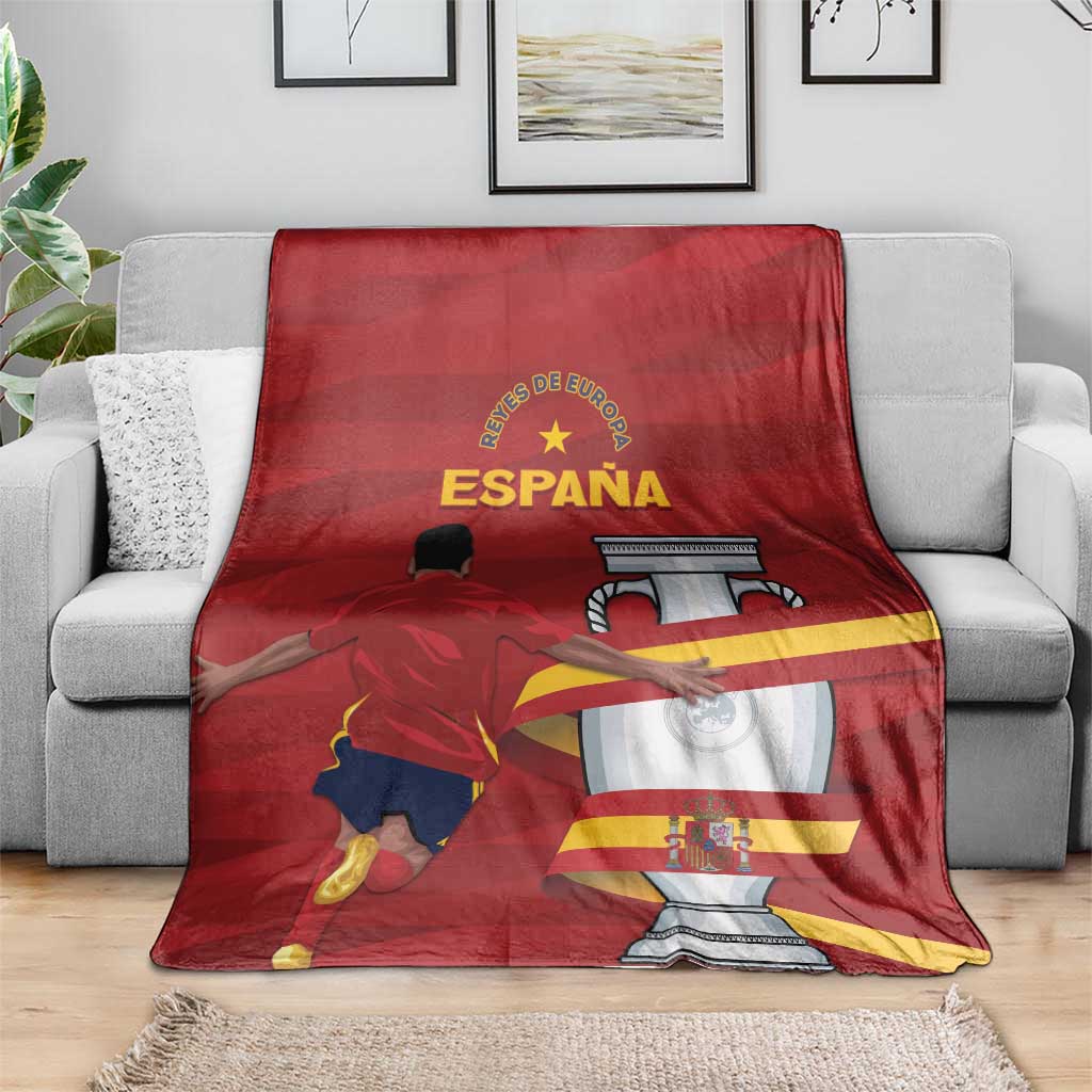 Red Spain blanket with Campeones graphic and trophy design