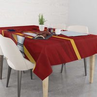 Red Spain-themed tablecloth with diagonal flag bands and emblem over dining table