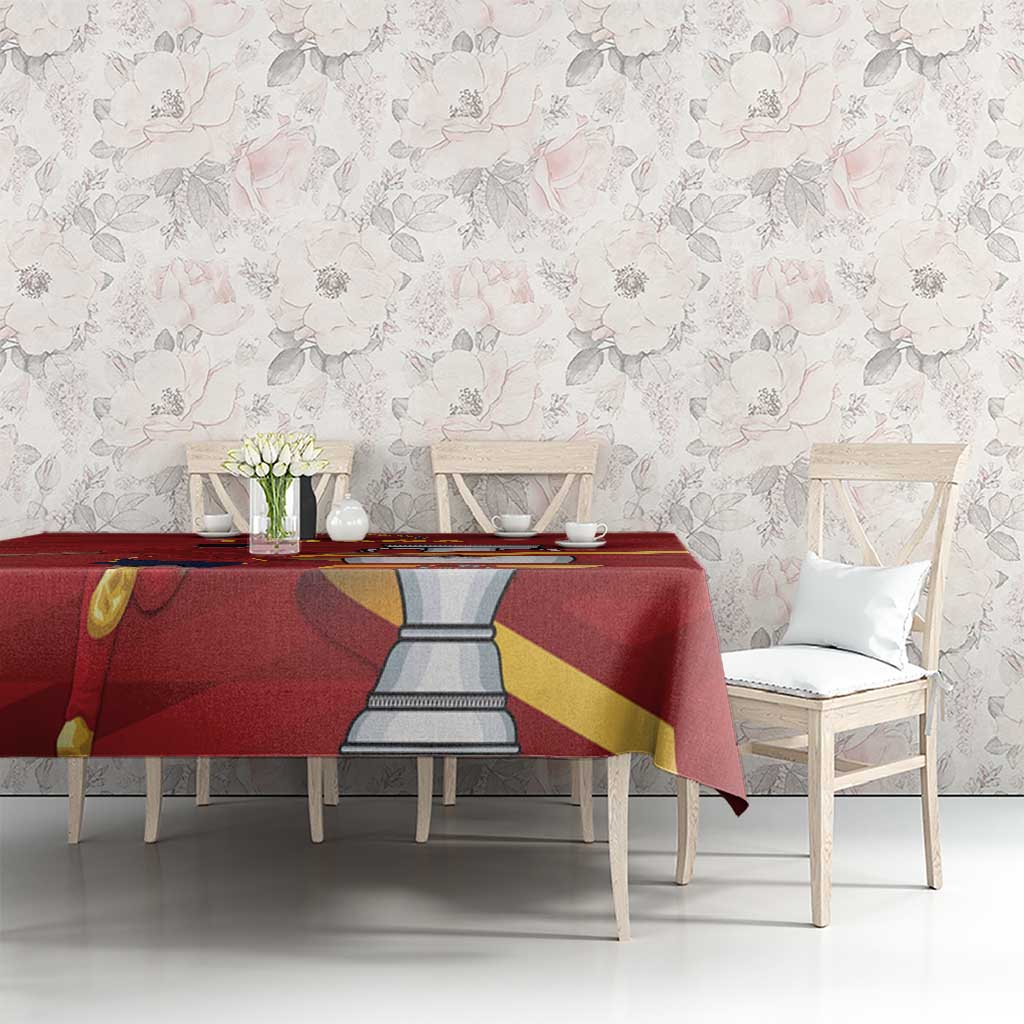 Red Spain-themed tablecloth with emblem and flag diagonals across dining table
