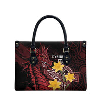Red and black leather-look tote bag with front Cymru logo and yellow star emblem, handles
