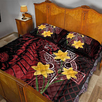 Quilt bed set on bed with black red dragon design, yellow clover shapes, Celtic cross