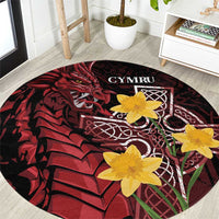Round black and red Welsh dragon area rug with yellow flowers and CYMRU text