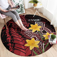 Round black and red Welsh dragon rug with yellow flowers, CYMRU and Celtic cross motif