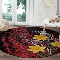 Round black and red Welsh dragon rug with yellow flowers and CYMRU lettering